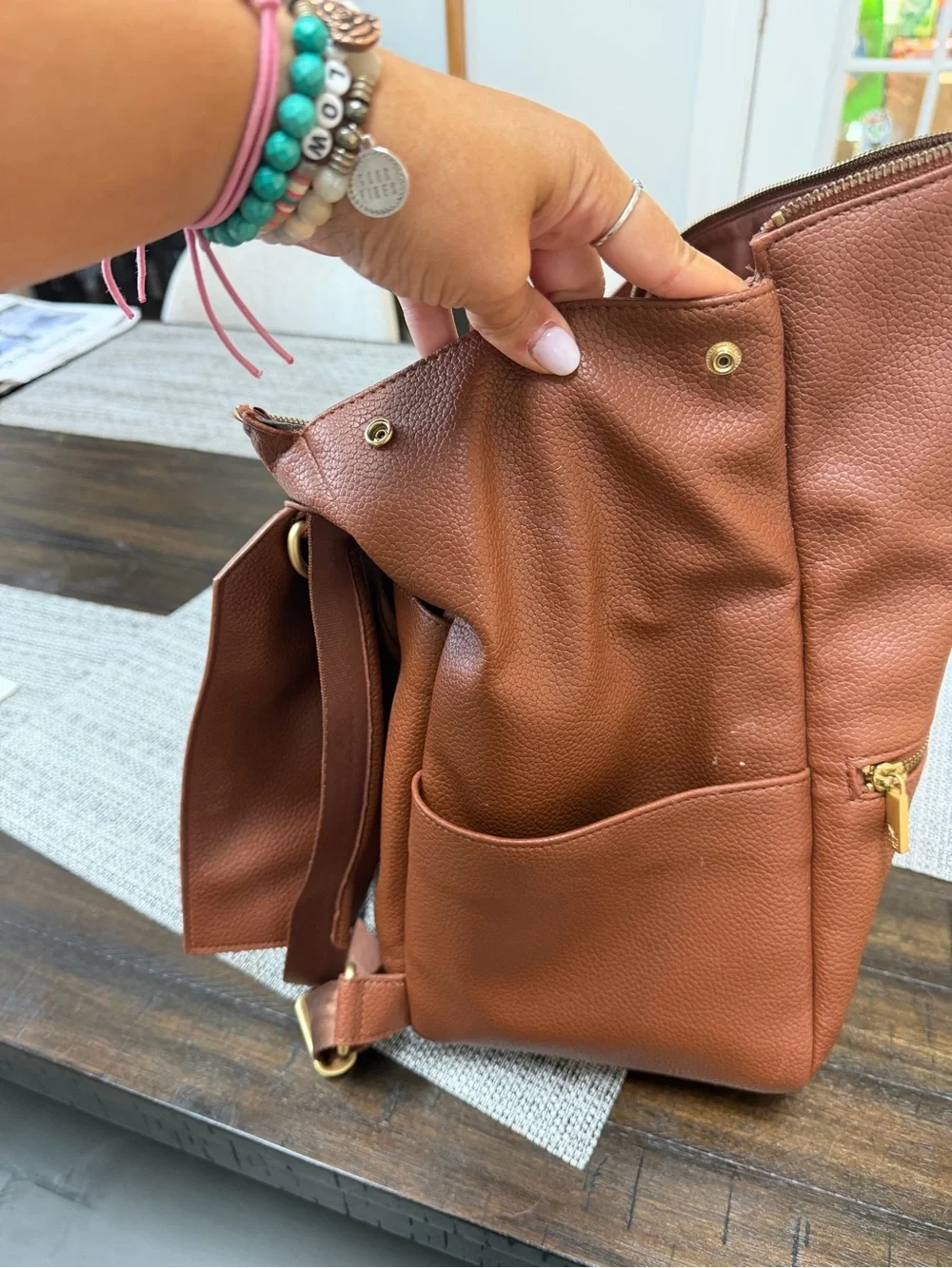 Freshly Picked Brown Leather-Textured Backpack with Gold Logo